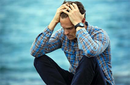 Man Holding His Head