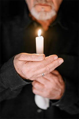 Man Holding Candle