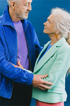 An older couple embracing