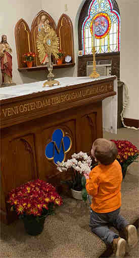 Johnathan looking at Jesus in the Blessed Sacrament