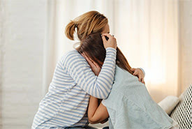 Mother and Daughter Embracing