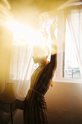 Person standing in the sunlight