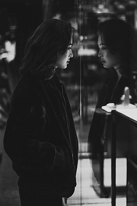 Woman gazing into the mirror
