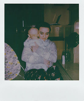 Polaroid of a Mom holding her baby