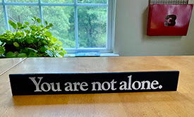 Sign that reads You are not alone