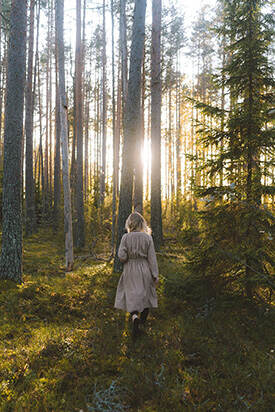 Woman walking in the woods