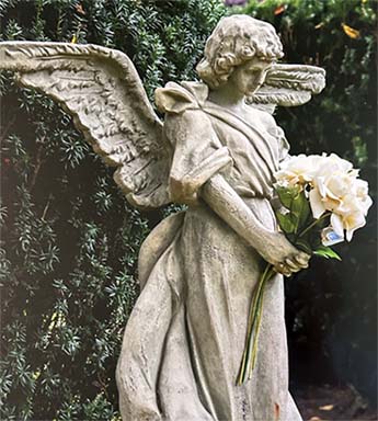 Angelic Statue Holding Roses