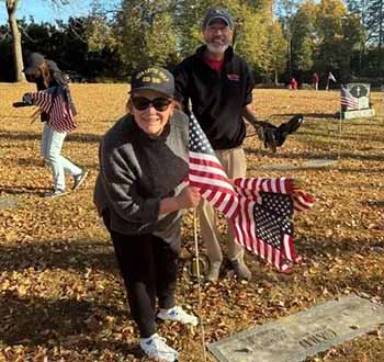 VFW volunteers replacing American flags