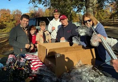 Volunteers replacing American flags