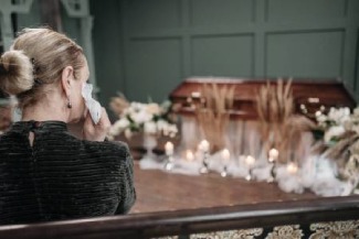 woman crying at funeral