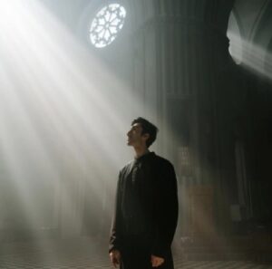 Man In Church In Ray of Light