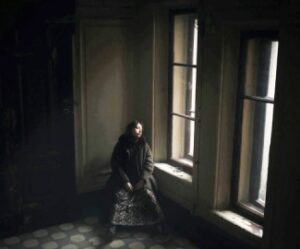 Woman Looking Out Window