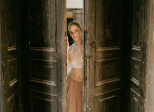 Woman Looking Through Door