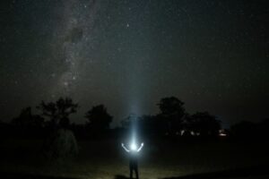 Light Shinning On Figure In Dark