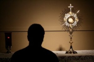 Man In Front Of Blessed Sacrament