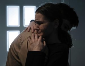 Woman Crying Hugging Man