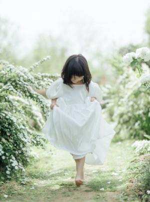 Little Girl in White Dress